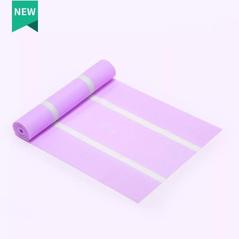 Purple yoga mat with alignment stripes, rolled and unrolled for home gym workouts