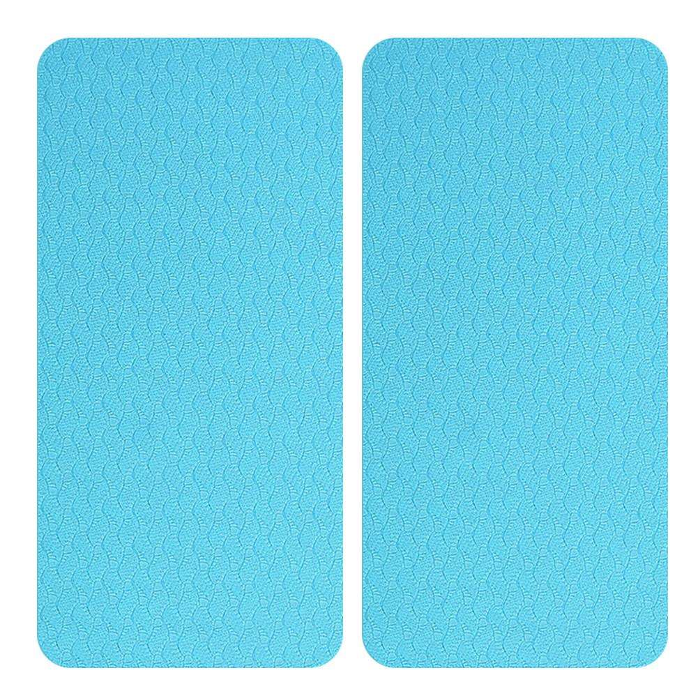 Light blue textured yoga mats with non-slip surface for home gym workouts and fitness routines