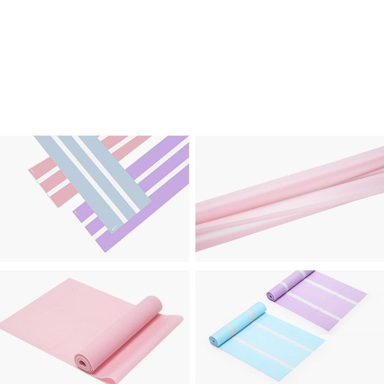 Pastel resistance bands and yoga mats for home workouts, featuring pink, blue, and purple options