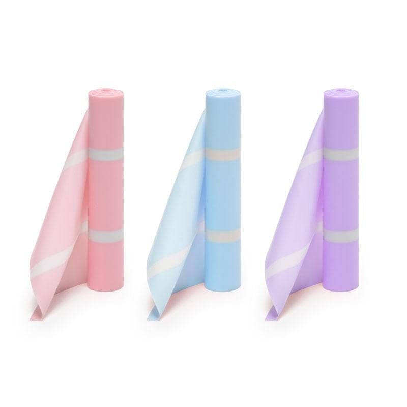 Pastel resistance bands in pink, blue, and purple for home workouts and strength training