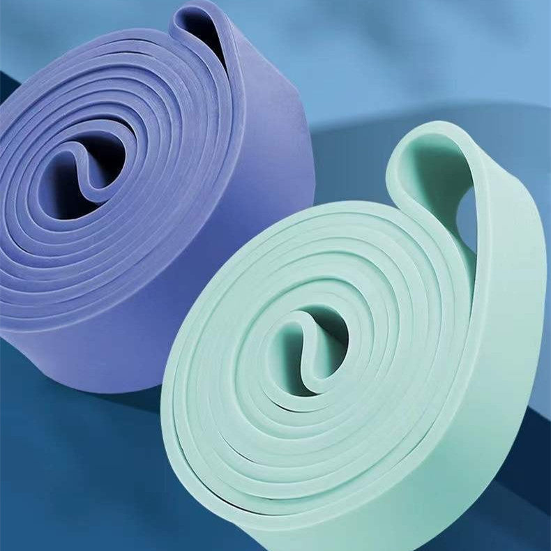 Set of fitness stretch resistance bands in various colors and sizes made of TPR material